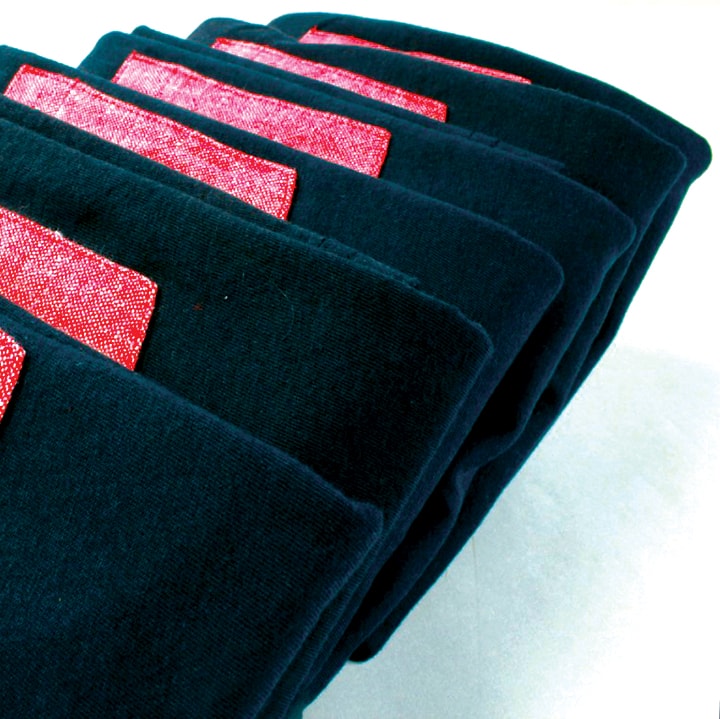 Stacks of blank apparel ready for high volume production