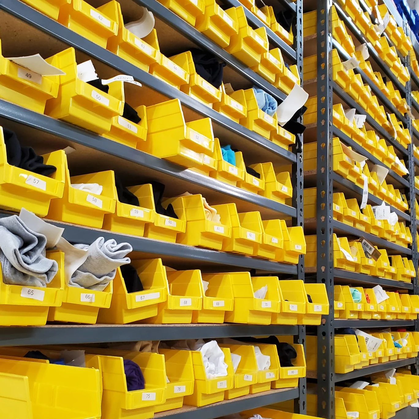 Apliiq warehouse shelves prepared for fulfillment